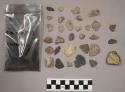 58 stone chips; 12 quartz chips; 3 pieces unglazed pottery; 1 bag charcoal bits