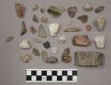 27 pieces quartz; 23 pieces stone; 4 pieces unglazed pottery; 1 piece bone?