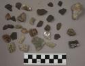 40 stone chips; 2 fragments pottery; 6 flakes stone; 9 fragments limestone and q