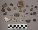 9 fragments limestone; 2 flakes stone; 1 fragment pottery; 21 fragments stone