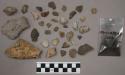 36 fragments quartz and limestone; sample earth; 69 fragments stone