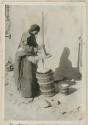 Woman churning butter