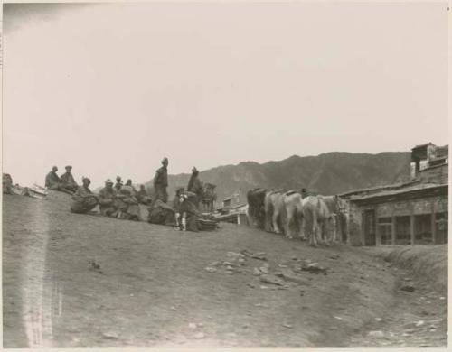 Tibetans with ponies on the hill near the temples of Labrang, Tibet