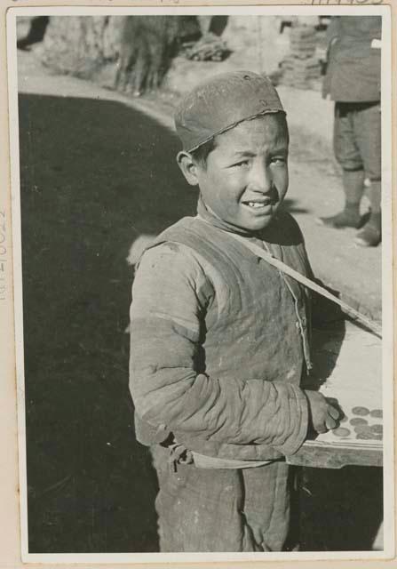 Boy with coins