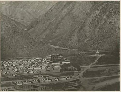 View of landscape, temples, and white stupa, Labrang, Tibet