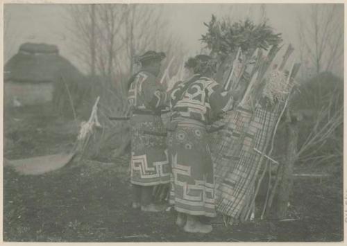 Men prepare altar for bear ceremony