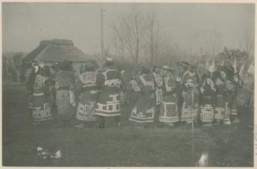 Men and women dancing at bear ceremony