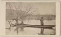 Three people in dugout canoe