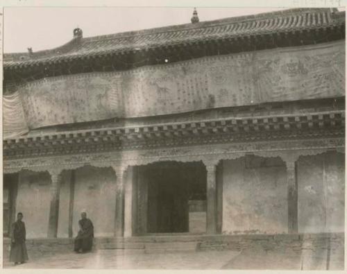Front of chanting hall with two men in front