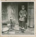 Young woman spinning with a spinning wheel outside a building