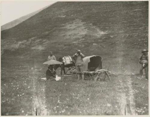 Mule litter and people resting in the grasslands