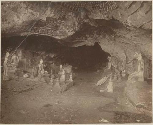 Interior of cave with carvings and statues