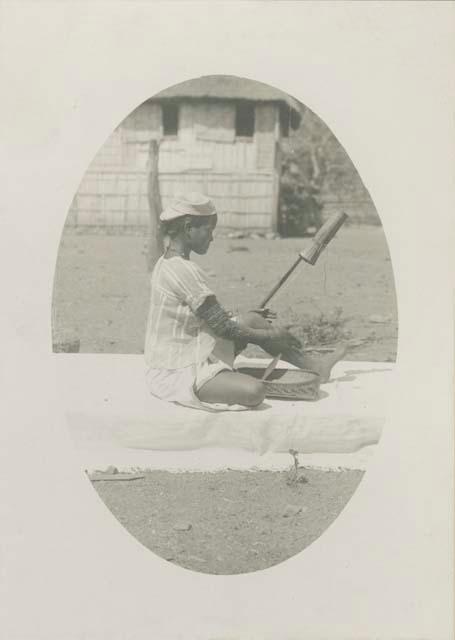 Tinguian woman spinning cotton