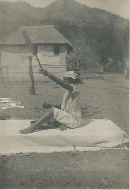 Tinguian woman spinning cotton