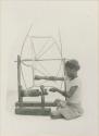 Young Tinguian girl skeining thread