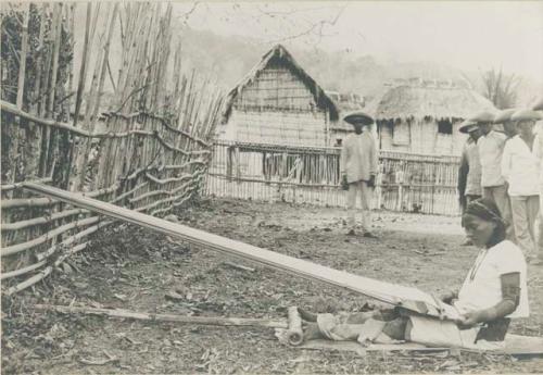 Tinguian woman weaving on a loom