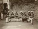 Group of men playing hand held drums