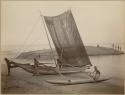 Fishing boat and people on shore