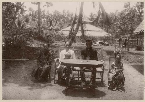 Four people sitting around a table