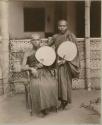 Two Buddhist Priest holding fans