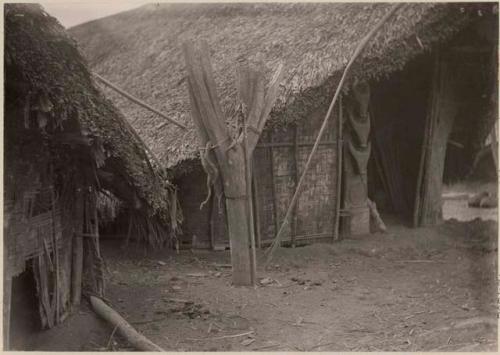 Thatched structure with carved wooden posts