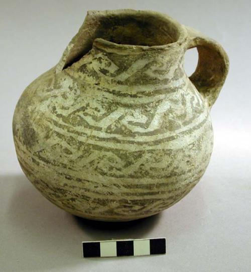 Black on white pottery jug