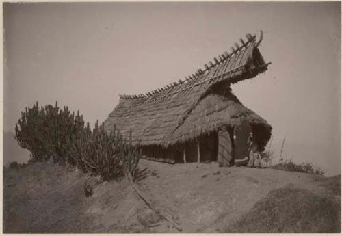 People in front of structure