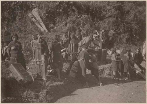 Group with suitcases and boxes