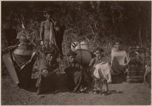 Group with lanterns, baskets and bundles