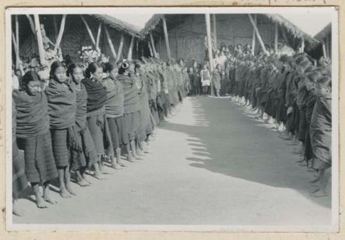 Girls lined up in front of building