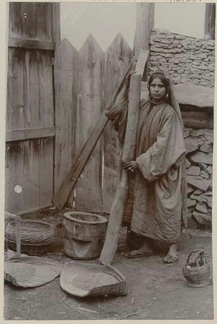 Woman pounding rice