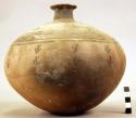 Ceramic bottle, round vertically grooved body, polychrome zoomorphic designs
