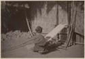 Woman weaving on loom