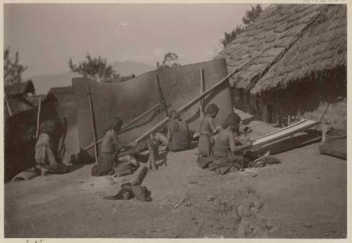 Women weaving on looms