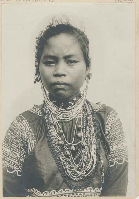 Bagobo woman wearing traditional clothing and jewelry