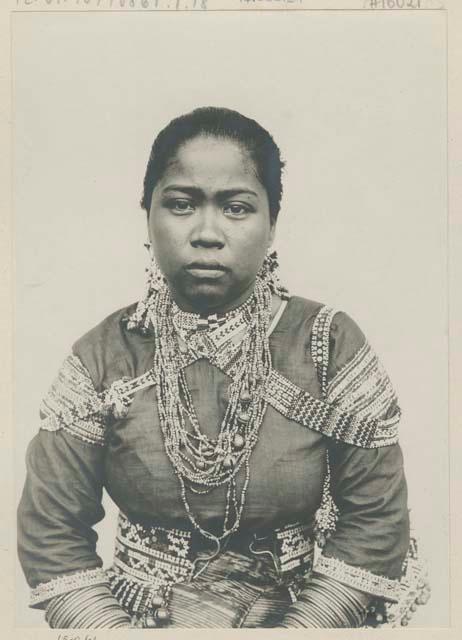 Bagobo woman wearing traditional clothing and jewelry