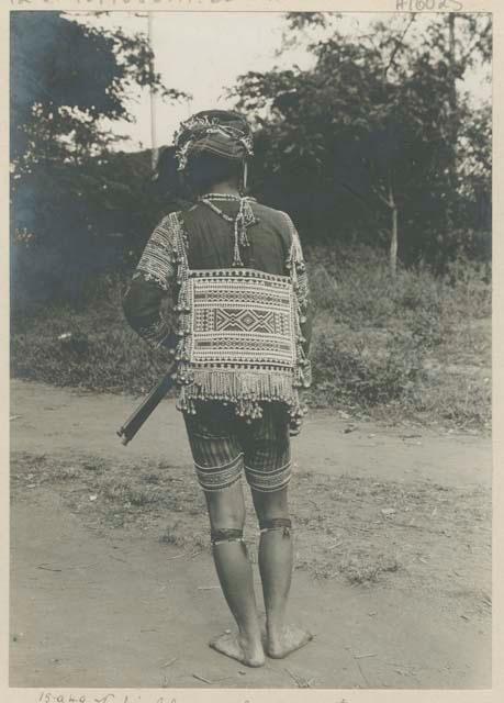 Bagobo person wearing traditional clothing, back