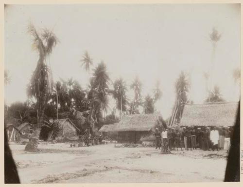 Group of people standing in front of buildings