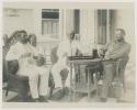 Men seated around table with drinks