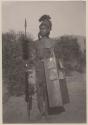 Man in headdress with shield and spear