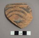 Ceramic rim sherd with painted geometric design on exterior