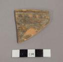 Ceramic rim sherd with painted geometric design on exterior