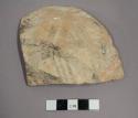 Ceramic body sherd, exterior painted with black geometric design on white background