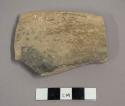 Ceramic rim sherd with plain burnished exterior, salt crystals on exterior