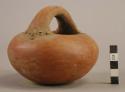 Red ware handled bowl - human face appliqued on 2 sides of bowl