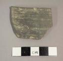 Ceramic rim sherd with plain exterior and interior