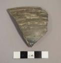 Ceramic rim sherd with plain exterior and interior