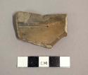 Ceramic rim sherd with plain exterior and interior