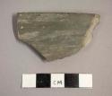 Ceramic rim sherd with plain burnished exterior and interior