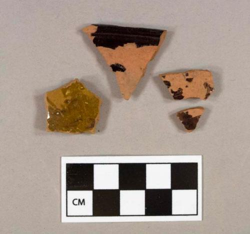 Three lead glazed redware body sherds, two refit; one lead glazed redware rim sherd